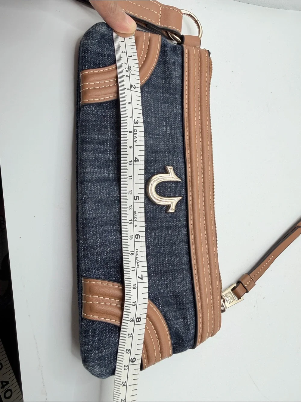 True Religion Denim Wristlet with Tan Trim and Gold Logo